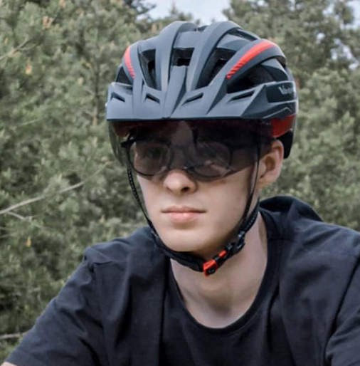 Man wearing bike helmet with goggles